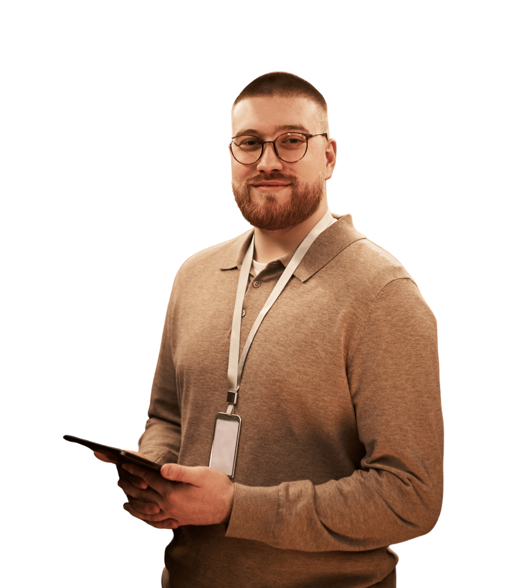 man with glasses smiling and holding a tablet